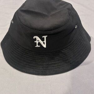 Nahmias corduroy bucket hat with an embroidered 'N' logo.